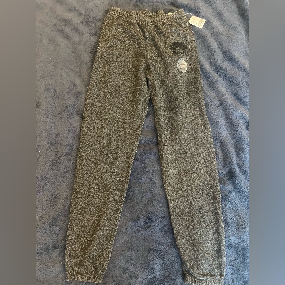 Roots classic black heather sweatpants with velvet logos.